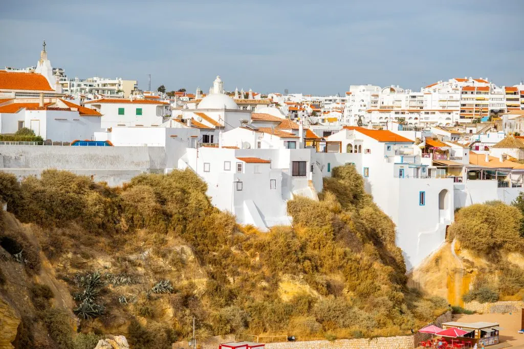 Cityscape view on the old town with beautiful white houses on the rocks in Albufeira city on the south of Portugal